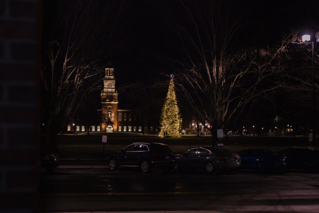 Christmas tree glowing on Dartmouth Green outside Hanover Inn