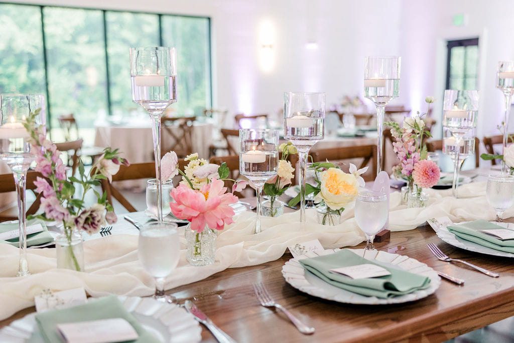 Colorful wildflower wedding centerpieces in apricot and lilac