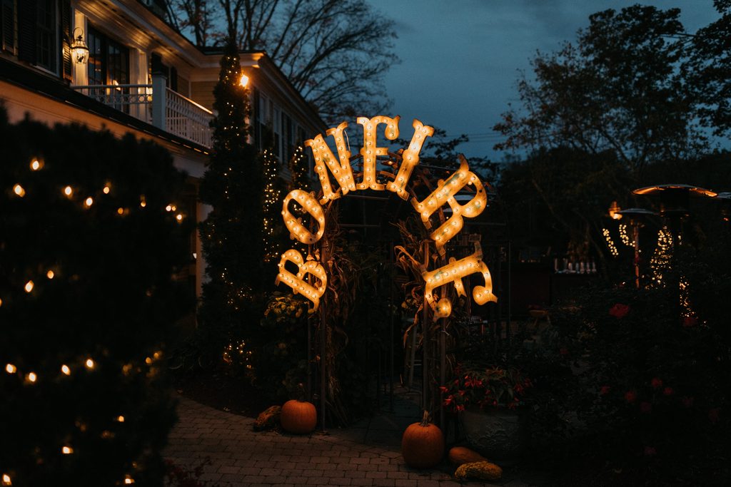 Illuminated fall entrance at Bedford Village Inn in New Hampshire