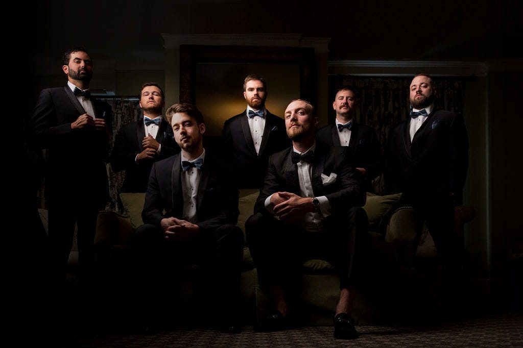 Alex and his groomsmen wearing black tuxedos at the Omni Mount Washington