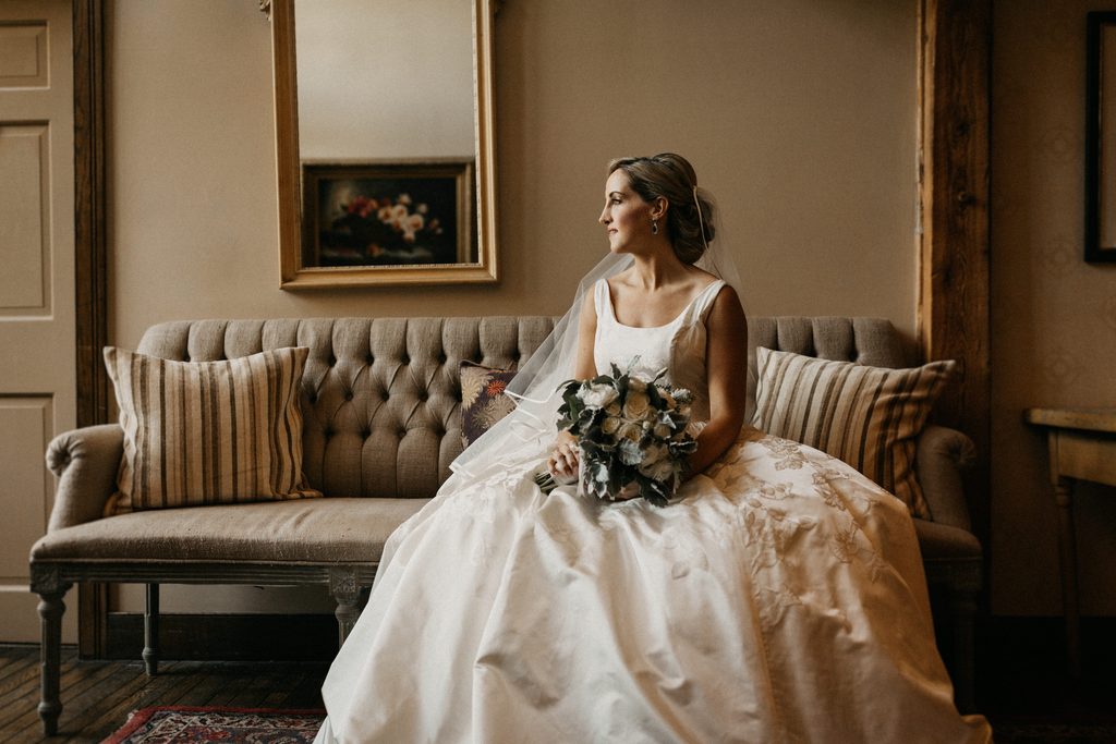Kerry holding her bouquet before her Bedford Village Inn wedding