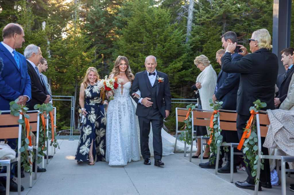 Bride walking down the ceremony aisle at Rosebrook Lodge at Omni Mount Washington Resort in Bretton Woods, New Hampshire