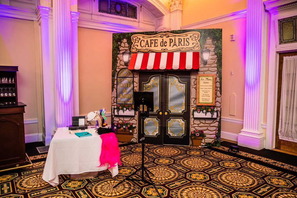 Café de Paris wedding photo booth inspired by the couple’s Paris proposal
