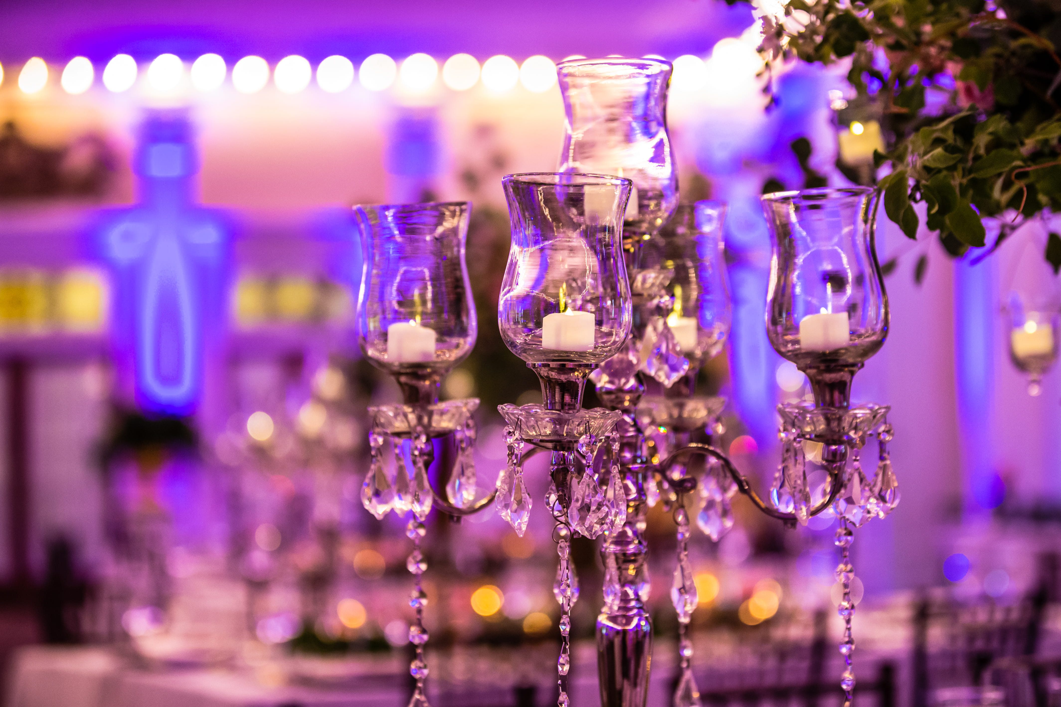 Crystal candleholder illuminated by purple reception lighting