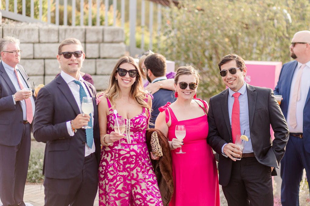 Guests in colorful formal attire at a fall wedding in New Hampshire