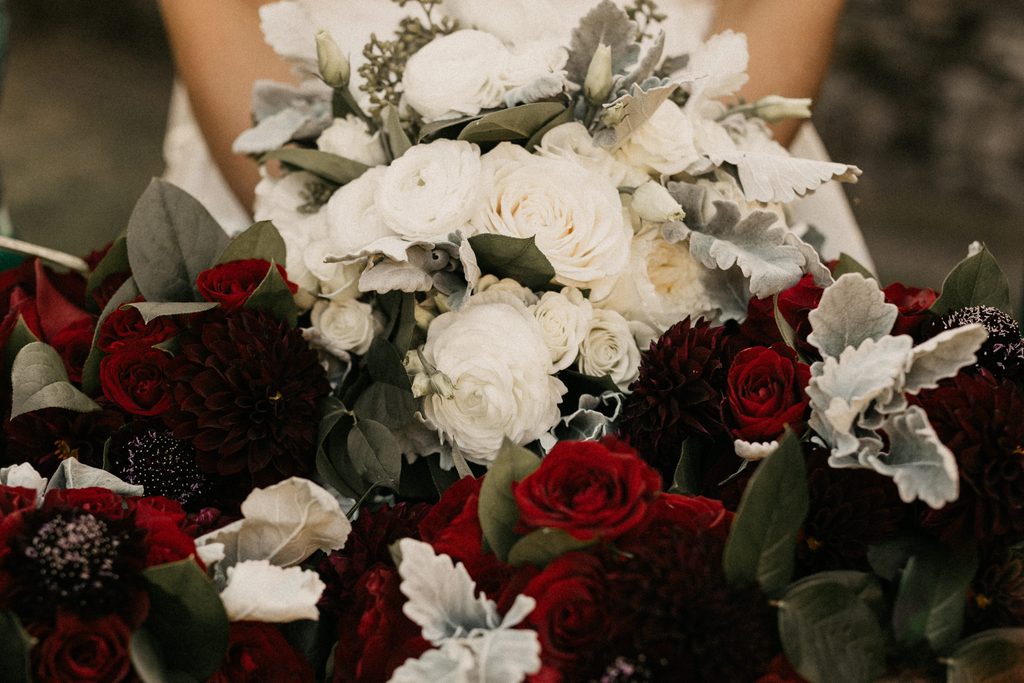 Deep-red and white fall wedding flowers with soft green foliage