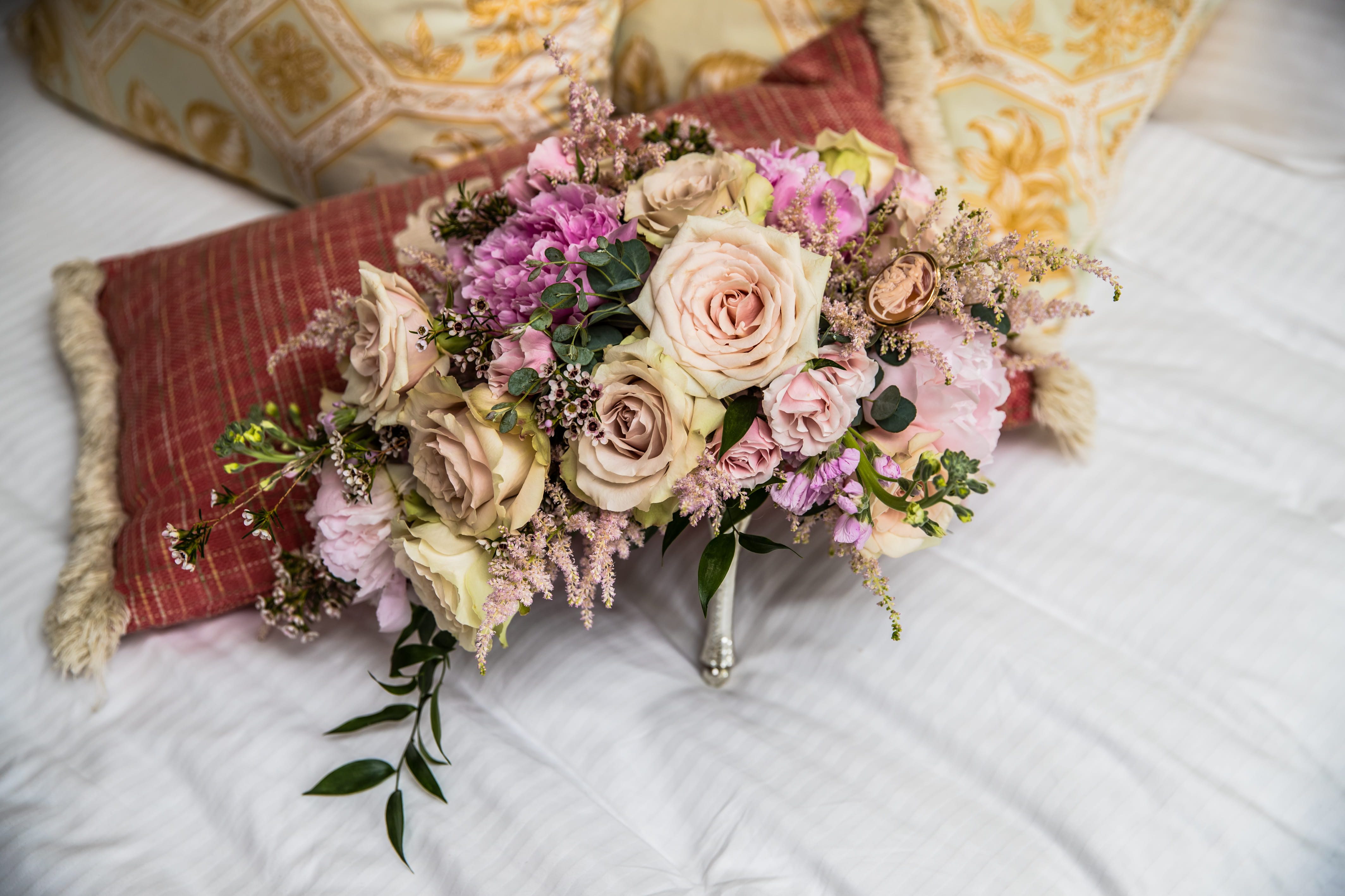Dusty pink and ivory bridal bouquet with roses and greenery