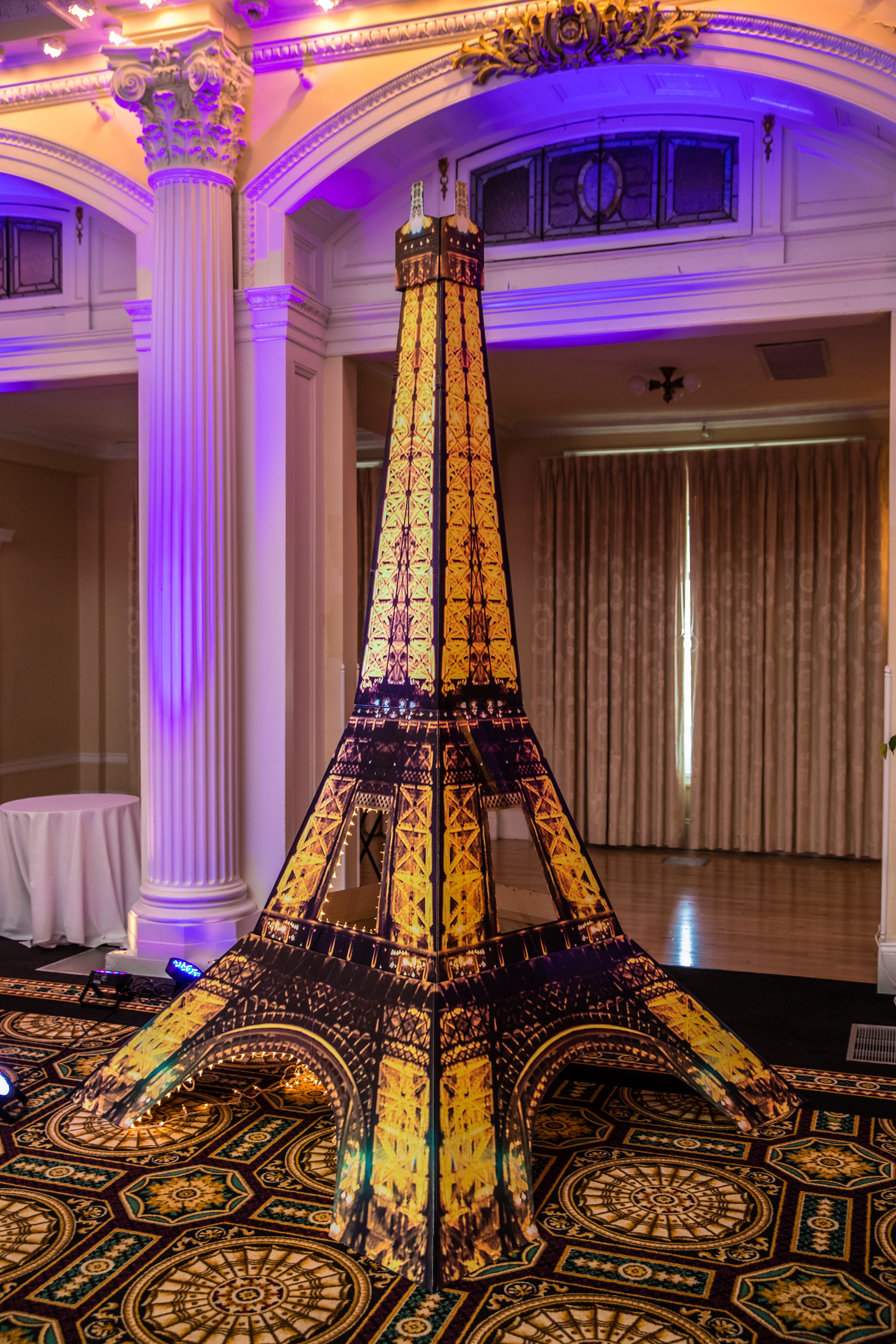Illuminated Eiffel Tower wedding display inspired by the couple’s Paris proposal