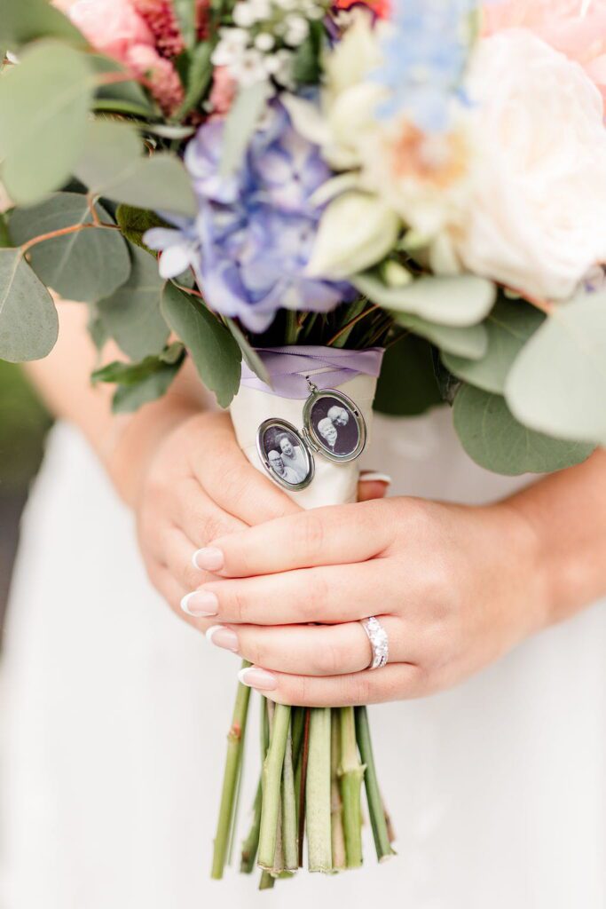 Memorial photo lockets attached to Emily’s wildflower bridal bouquet