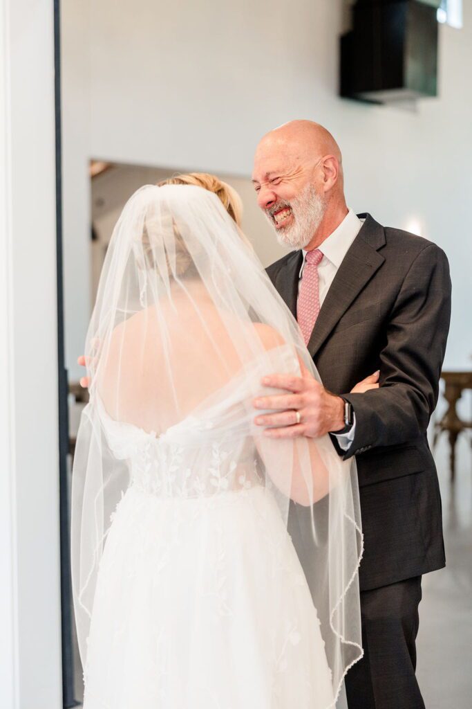 Emily sharing a joyful first look with her father