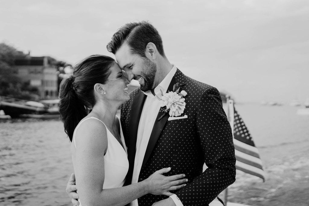 Erin and Rob sharing a quiet moment during their boat ride around Marblehead Harbor