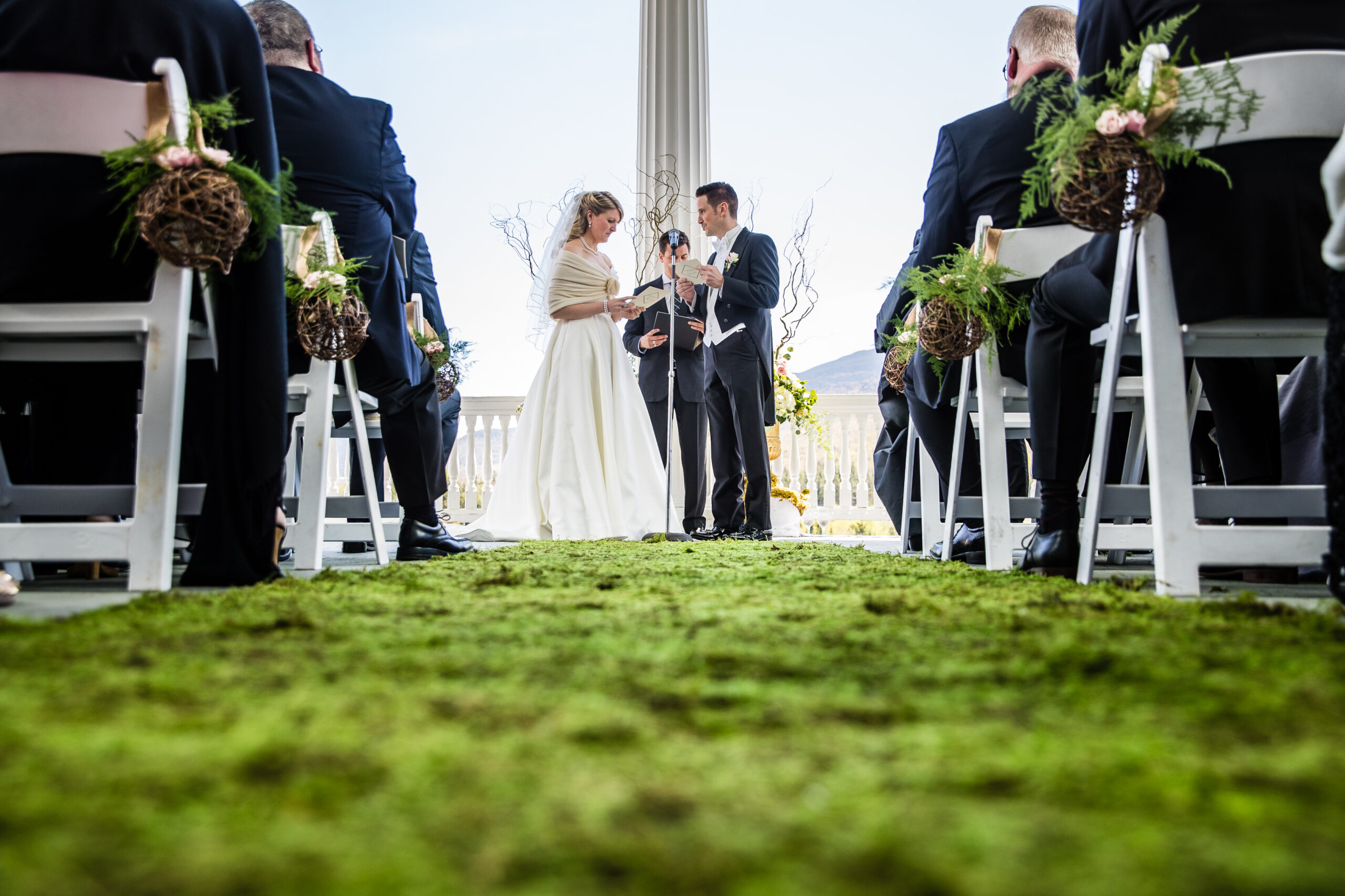 Woven greenery and pink rose decoration attached to a ceremony chair at Omni Mount Washington Resort in Bretton Woods, New Hampshire