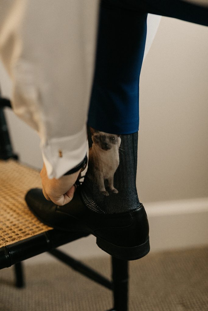Jake wearing custom dog socks with his wedding attire