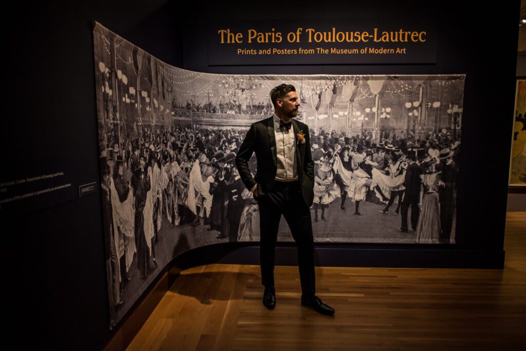 Brian posing inside the Toulouse-Lautrec exhibition at the Currier Museum