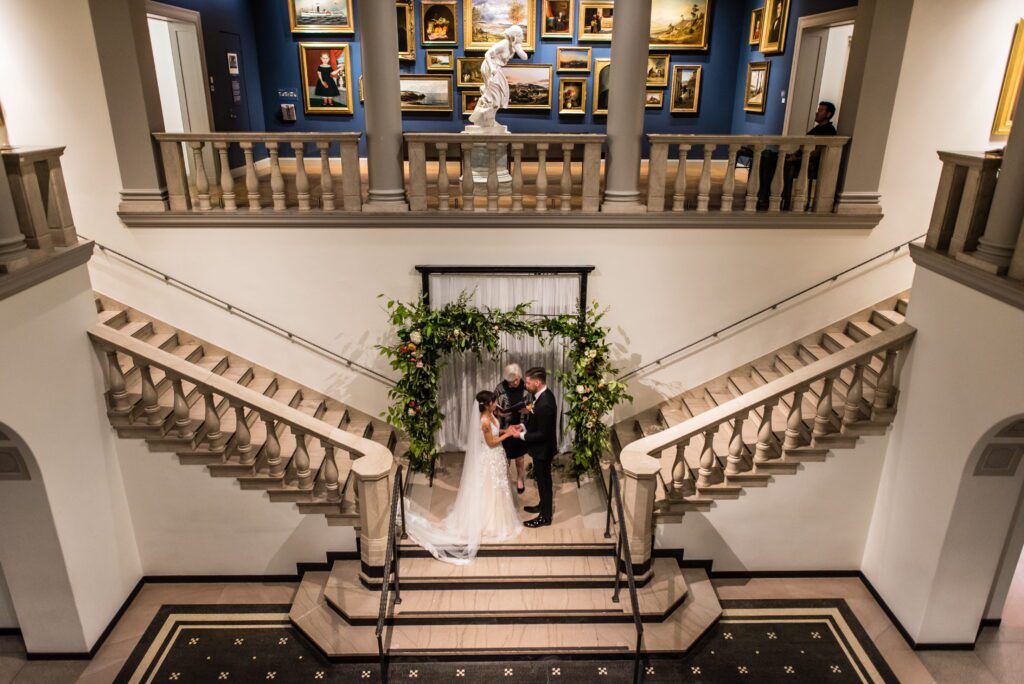 Intimate wedding ceremony on the grand staircase at the Currier Museum of Art