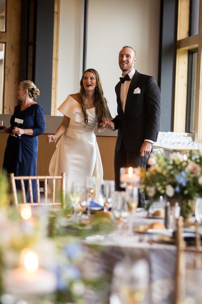 Katie and Alex entering their reception inside Crystal Hills at Rosebrook Lodge