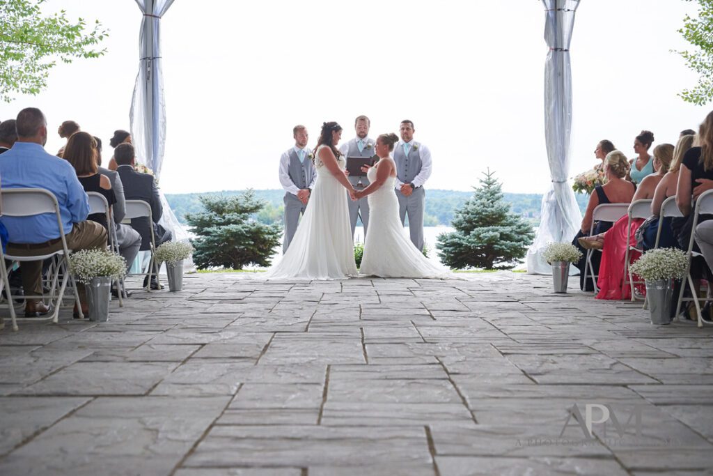 Lakeside ceremony aisle with baby’s breath arrangements at Margate Resort on Lake Winnipesaukee in Laconia, New Hampshire