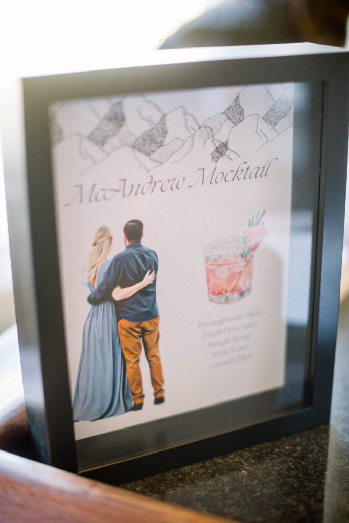 Custom McAndrew Mocktail sign featuring an illustrated portrait of Nicole and Tom