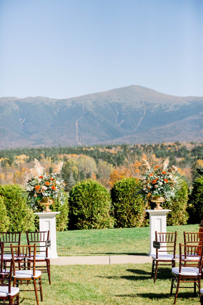 Outdoor wedding ceremony overlooking Mount Washington in Bretton Woods