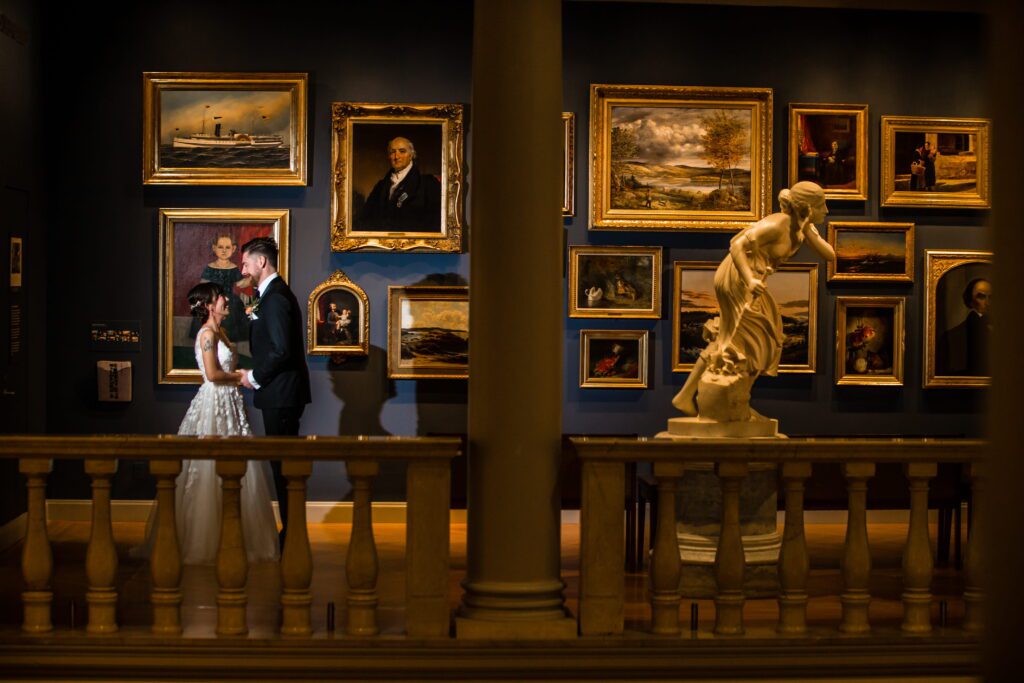 Kaori and Brian standing together in an art gallery at the Currier Museum