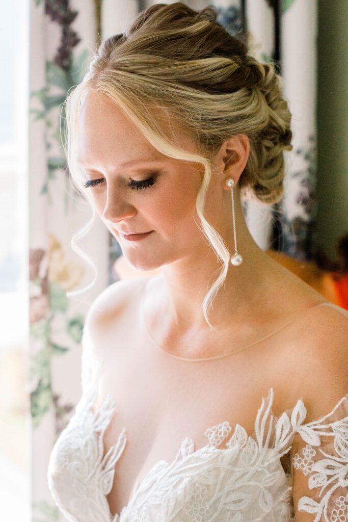 Close-up bridal portrait of Nicole in her lace wedding dress