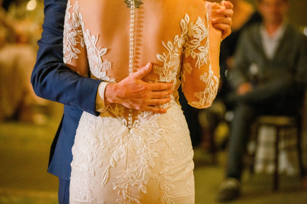 Close-up of Nicole’s lace wedding dress during her first dance with Tom