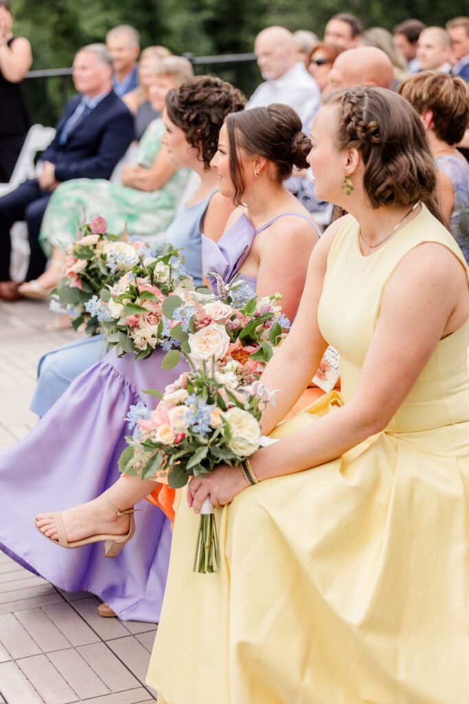 Wedding party and family in pastel formal attire at a New Hampshire venue