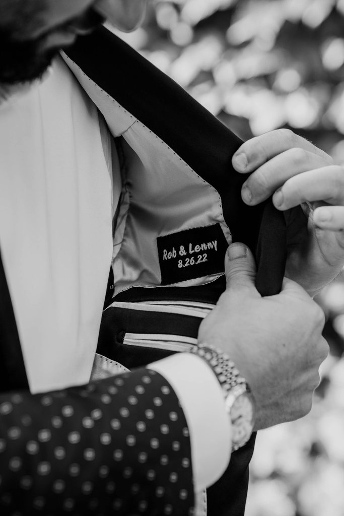 Personalized embroidery inside the groom’s wedding suit