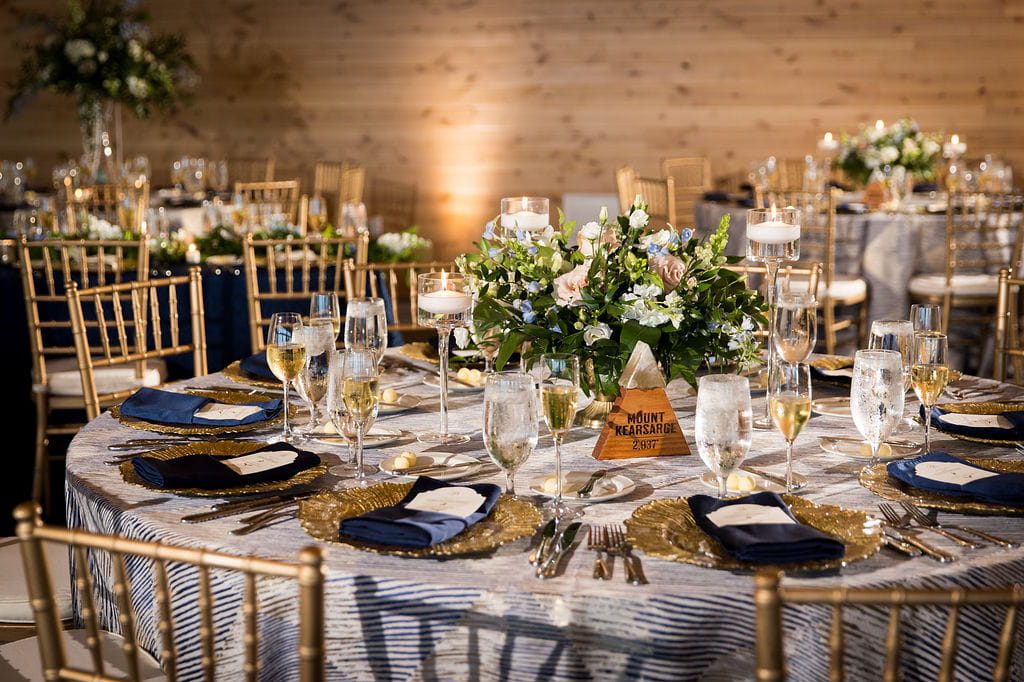 Cornflower blue and gold wedding table inside Crystal Hills at Rosebrook Lodge