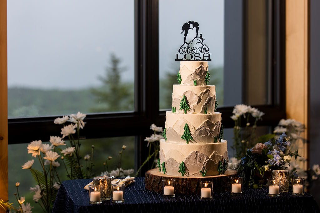 Mountain-themed wedding cake with pine trees at Rosebrook Lodge
