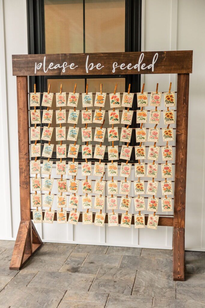 Seed packet escort card display for a summer garden wedding at Hyla Brook Estate
