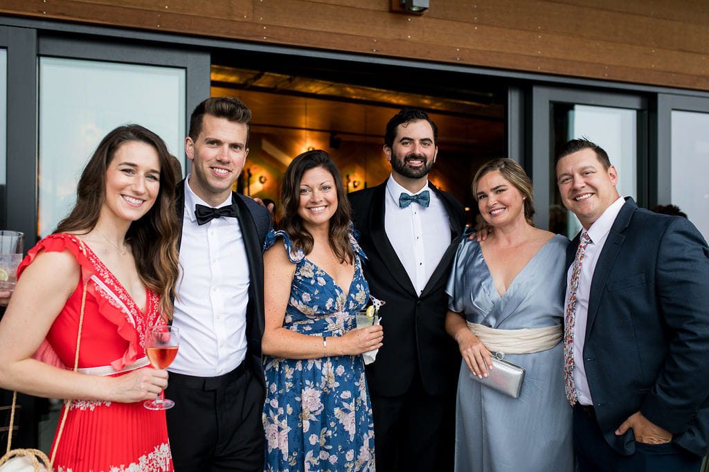 Guests in colorful summer formal attire at a New Hampshire wedding
