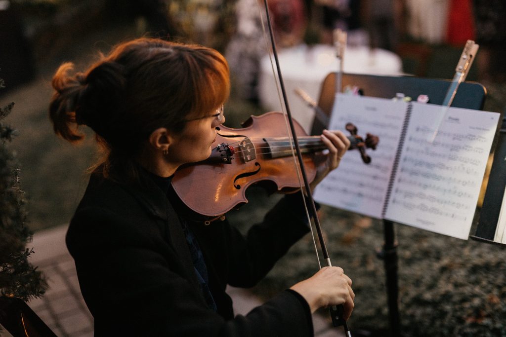 Violinist performing at Kerry and Jake’s Bedford Village Inn wedding